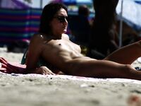 Standing Confident on a Sunny Nude Beach Day