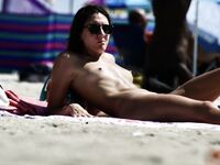 Standing Confident on a Sunny Nude Beach Day