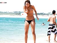 Topless Beach Paddle Ball Game by Turquoise Water