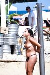 Two Topless Women Chatting by Clear Blue Water