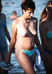 The beauty of bare skin and the vast ocean at a naturist-friendly shore. 2