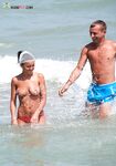 The beauty of bare skin and the vast ocean at a naturist-friendly shore. 2