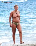 Artful photography of a woman enjoying the freedom of a clothes-free holiday.