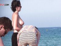 The joy of a topless swim in the clear, invigorating coastal waters. 3