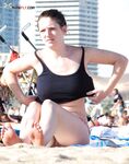 The feeling of the salt air on bare skin during a walk at a nude beach.