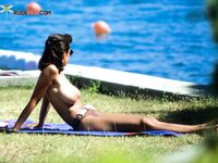 . The joy of a topless afternoon spent relaxing by the vast ocean. 2