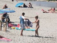 Despite cloudy weather and few people on the beach, my wife decided to have a little fun!.