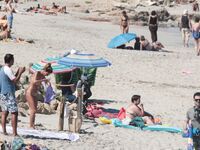 Despite cloudy weather and few people on the beach, my wife decided to have a little fun!.