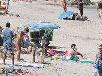 Despite cloudy weather and few people on the beach, my wife decided to have a little fun!.
