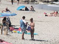 Despite cloudy weather and few people on the beach, my wife decided to have a little fun!.