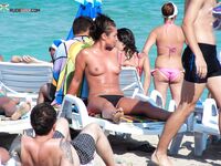 A lady enjoying the tranquility of the coast in a natural topless fashion. 3