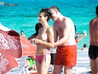 A lady enjoying the tranquility of the coast in a natural topless fashion. 3