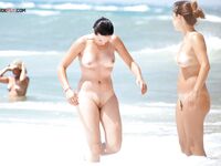 Embracing the European coastal tradition of topless summer relaxation. 2