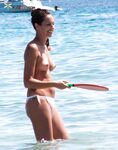 A spontaneous topless shoot on a boardwalk overlooking the ocean waves. 2