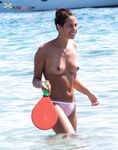 A spontaneous topless shoot on a boardwalk overlooking the ocean waves. 2