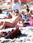 A spontaneous topless shoot on a boardwalk overlooking the ocean waves. 2