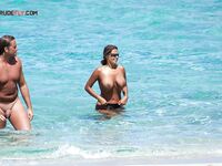 Thin Waist Chain Catches the Light in Turquoise Shallows