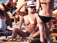 The simple life: bare feet in the sand and the sun on a topless chest.