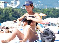 Capturing the graceful beauty of a woman at a quiet, nude coastal spot. 3