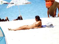 Wading Through Shallow Sea Water in Striped Bikini Bottoms