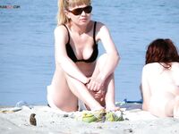 One Nude Beach Visitor Wearing a Bright Orange Cap