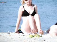 One Nude Beach Visitor Wearing a Bright Orange Cap