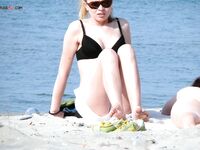 One Nude Beach Visitor Wearing a Bright Orange Cap