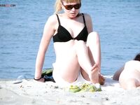 One Nude Beach Visitor Wearing a Bright Orange Cap