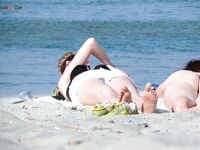 One Nude Beach Visitor Wearing a Bright Orange Cap