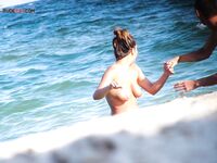 The feeling of the warm sand and the sun on a bare, sun-kissed figure. 2