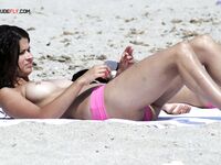 The sensation of the salt air and sun on a bare, topless figure. 2