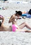 The sensation of the salt air and sun on a bare, topless figure. 2