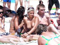 Rainbow Towel Recline and Oversized Shades on the Topless Beach