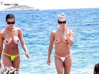Here are a couple of gorgeous women taking a shower outdoors at a naturist resort. 2