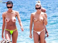 Here are a couple of gorgeous women taking a shower outdoors at a naturist resort. 2