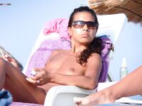 The sensation of the salt air and sun on a bare, topless figure. 3