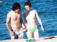 A lady relaxing on a wooden pier in a state of total freedom and nudity. 2