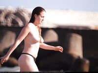 The best place to show your tattoo. On the nude beach. Look at these tattoos!.