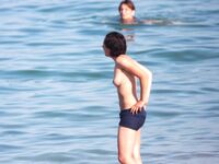 Embracing the elements: salt air, warm light, and the liberty of being topless. 2