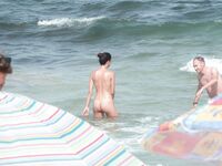 Gentle Waves Lap at Her Feet Along a Natural Shoreline