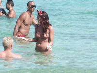 Gentle Waves Lap at Her Feet Along a Natural Shoreline