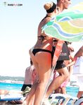 Crowded Topless Beach Moment in Dark Bikini Bottoms