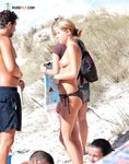 Crowded Topless Beach Moment in Dark Bikini Bottoms