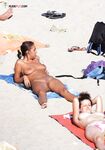 Here are a couple of gorgeous women taking a shower outdoors at a naturist resort. 3