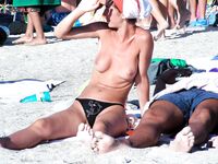 Cross-Legged on a White Lounger Beneath a Green Parasol