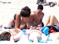 The beauty of a natural, full-body tan being earned at a local nude beach. 2