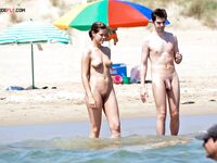 Nude Beach Shoreline with Sun Loungers on the Sand