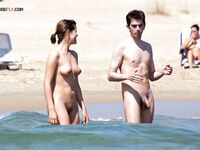 Nude Beach Shoreline with Sun Loungers on the Sand