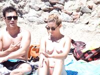 One Woman with Pink Hair on a Topless Beach