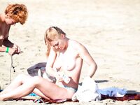 One Woman with Pink Hair on a Topless Beach